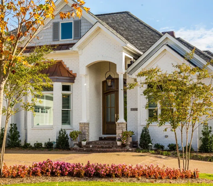 White brick exterior of a RALLE Homes custom home